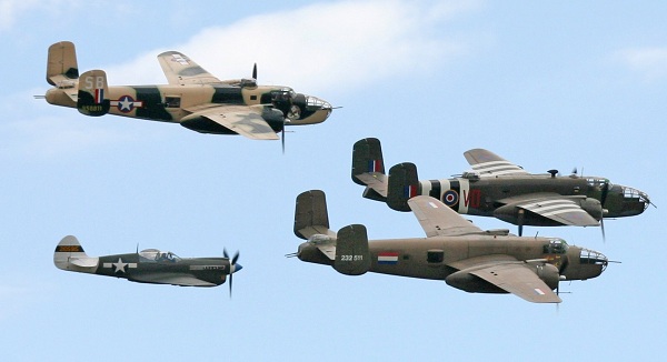  A fighter aircraft and 3 bombers of the World War II era. 